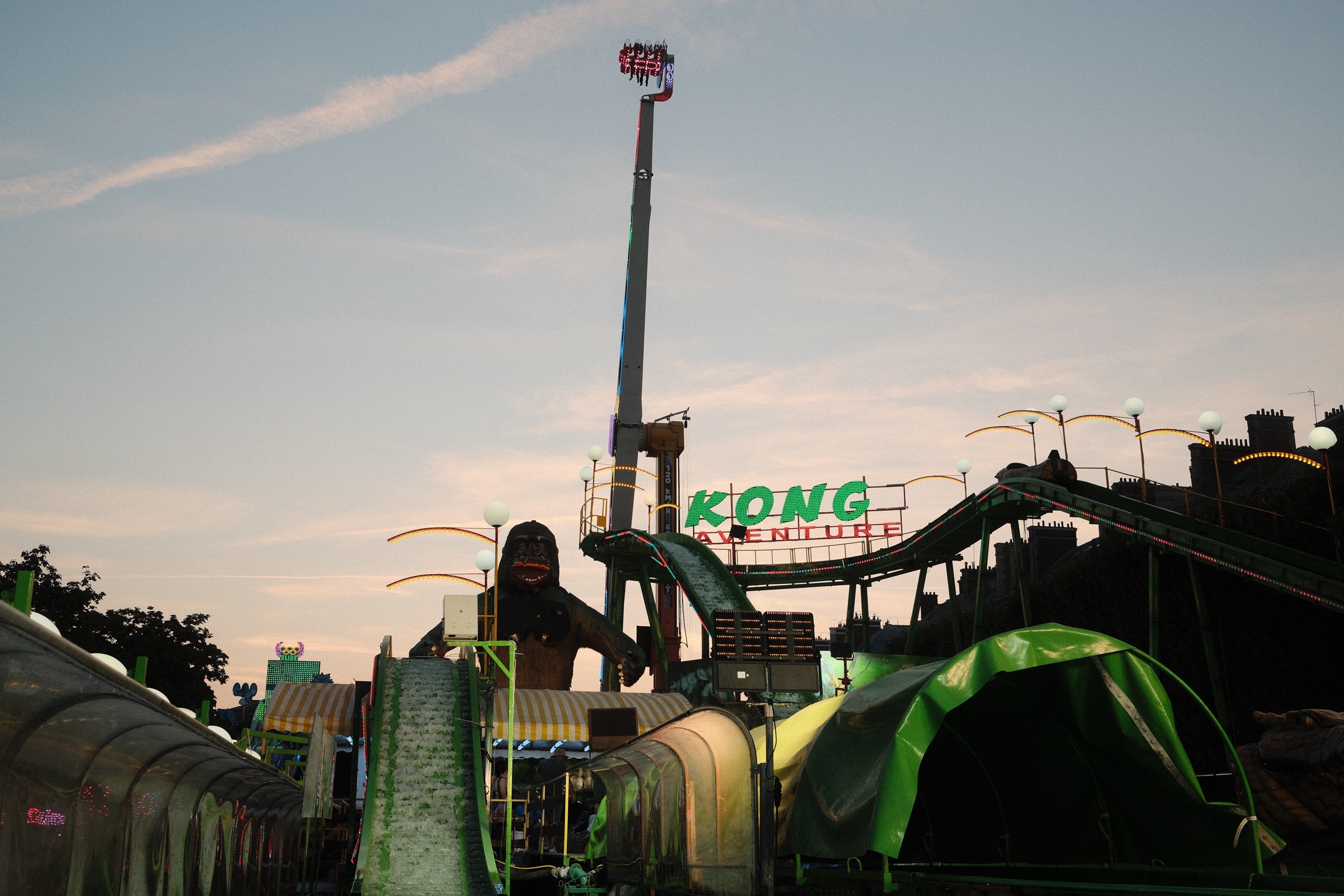 The Kong ride looming over a summer fair at dusk