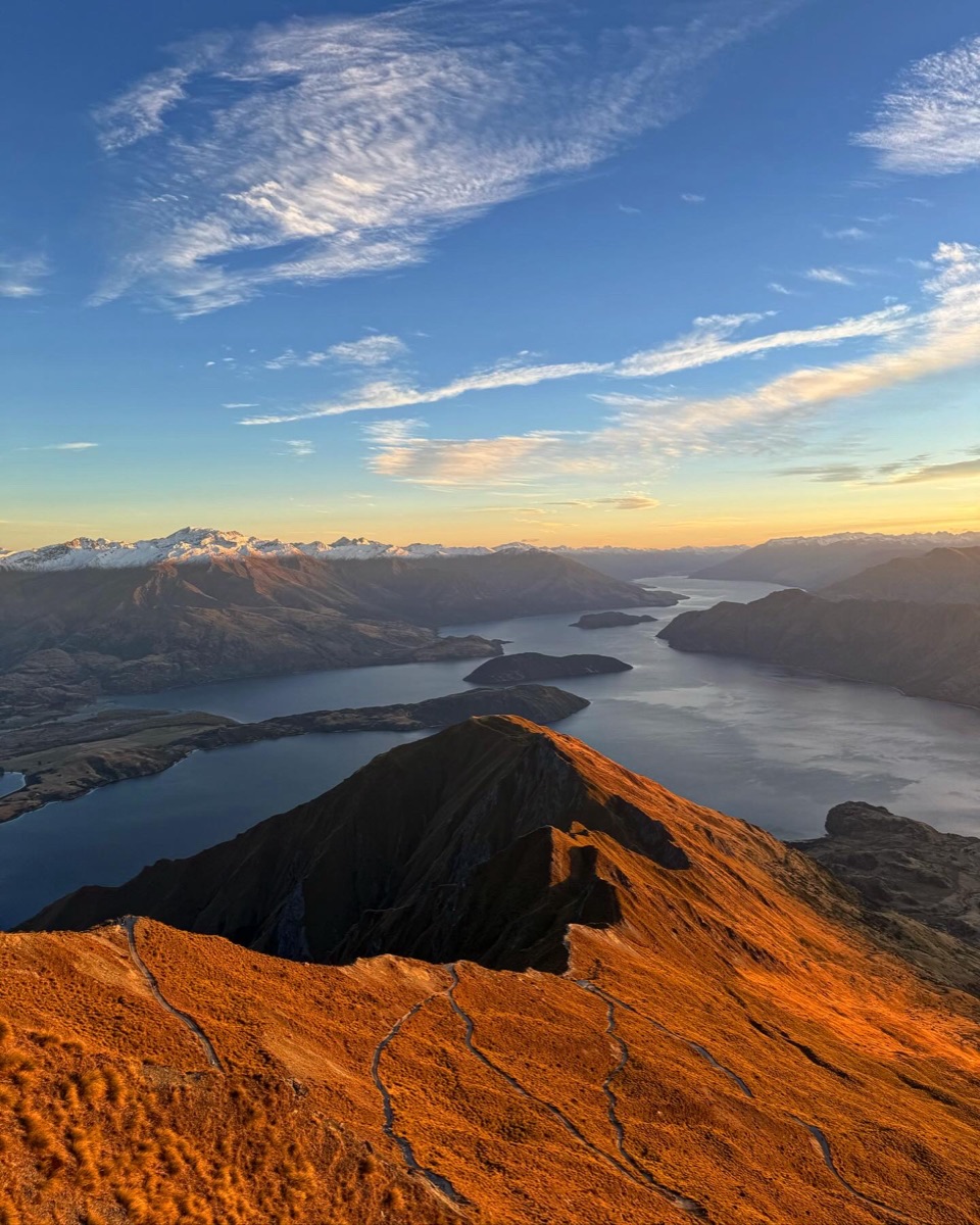 First light on a volcanic ridge above a lake