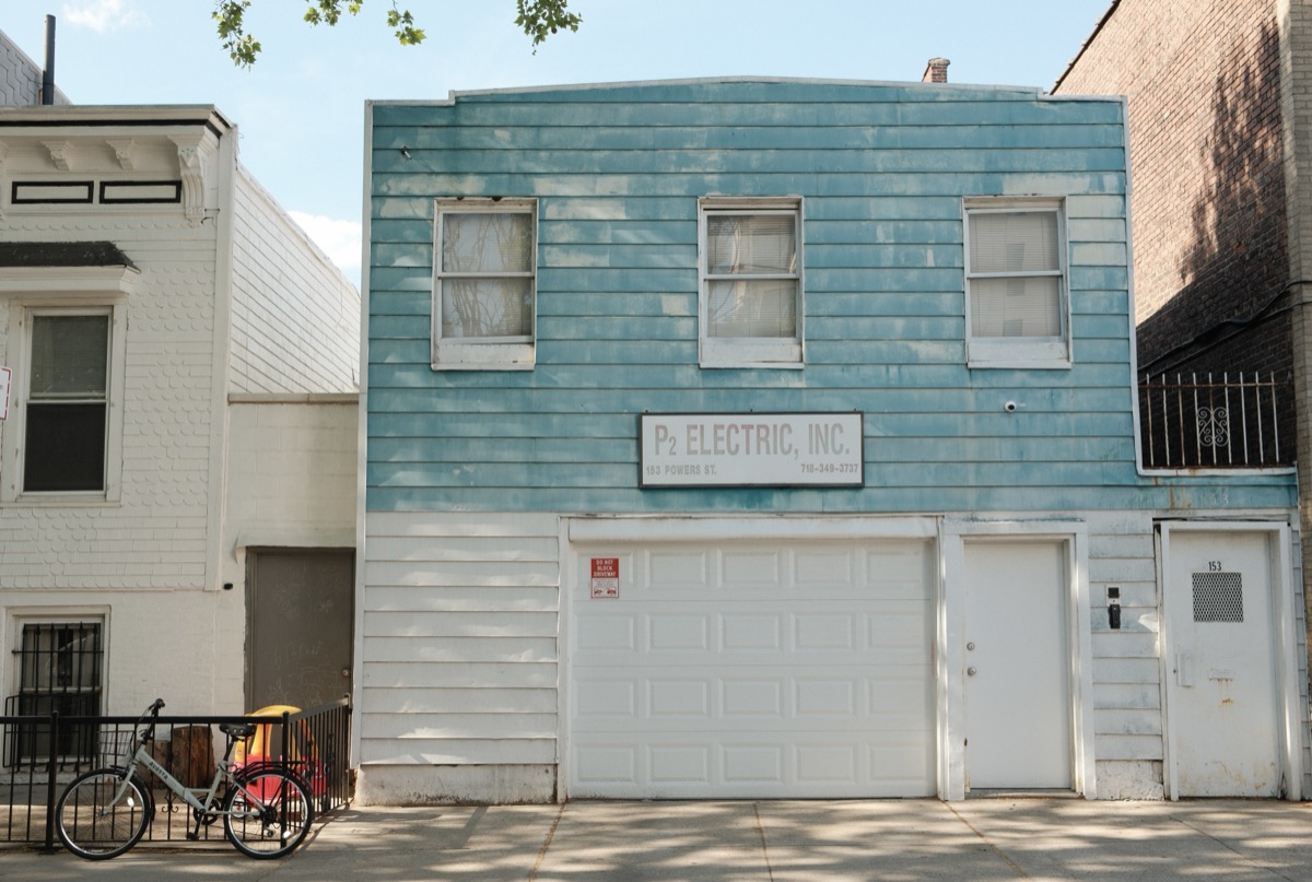 A pale blue clapboard storefront
